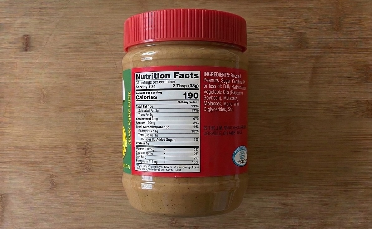 Jif peanut butter jar showing hydrogenated vegetable oils including rapeseed and soybean on the ingredient label